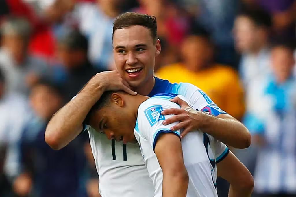 Harvey Vale celebrates a goal with the England youth team.
