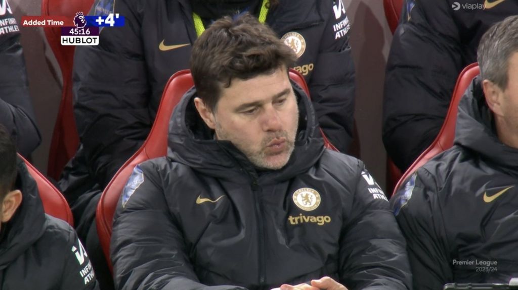 Mauricio Pochettino looks unhappy in the dugout.