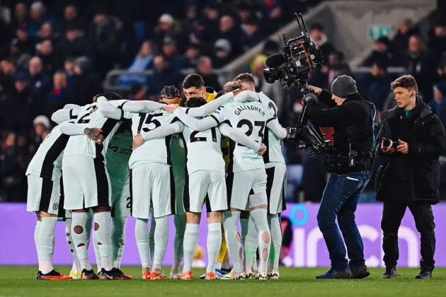 Chelsea's players huddle around pre-match