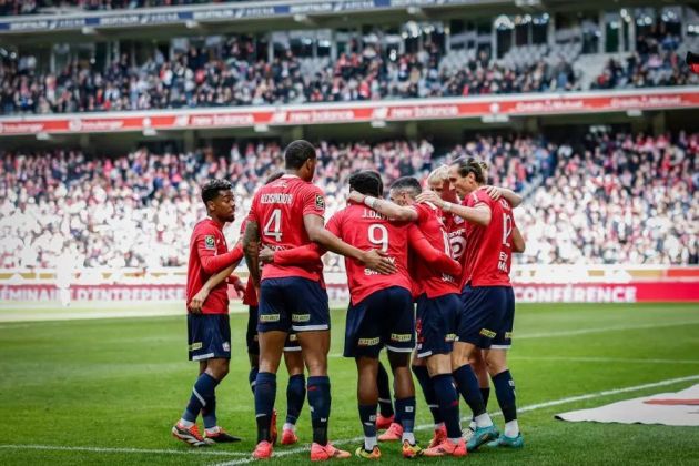 Lille celebrate a goal with Jonathan David central.
