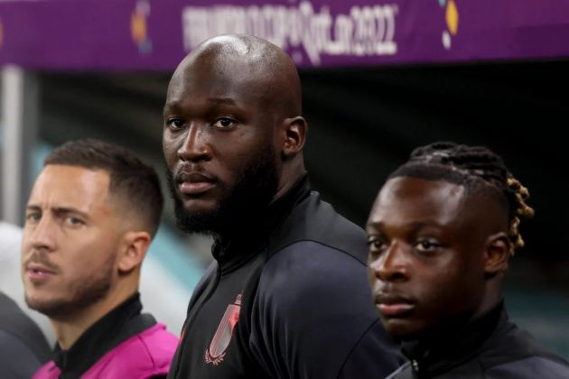 Romelu Lukaku stands between Eden Hazard and Jeremy Doku.