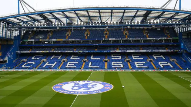 The Chelsea logo on the pitch at Stamford Bridge.