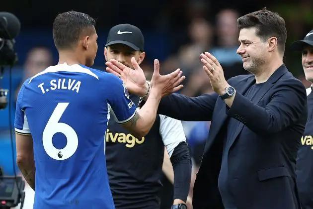 Thiago Silva and Mauricio Pochettino embrace.