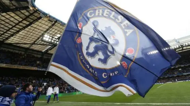 Chelsea flag waves at Stamford Bridge.