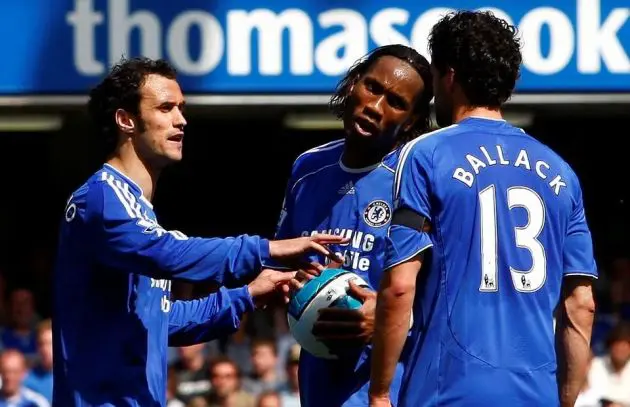 Michael Ballack with the number 13 shirt argues about a penalty.