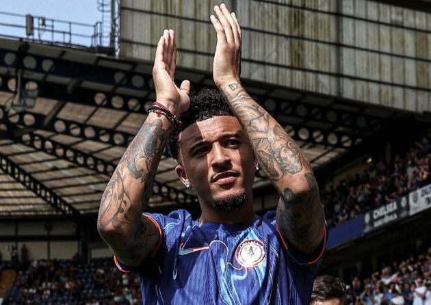 Jadon Sancho greets the fans at Stamford Bridge.