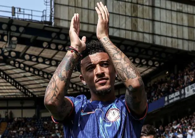 Jadon Sancho greets the fans at Stamford Bridge.