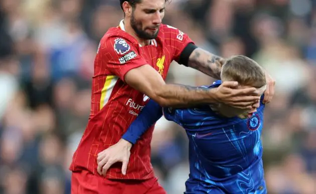 Cole Palmer fouled and tightly marked byLiverpool. (Photo by Carl Recine/Getty Images)