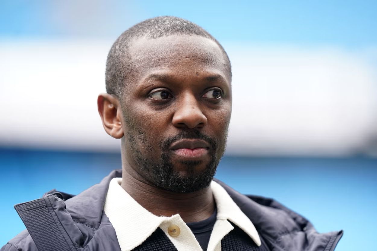 Shaun Wright-Phillips at a football stadium.