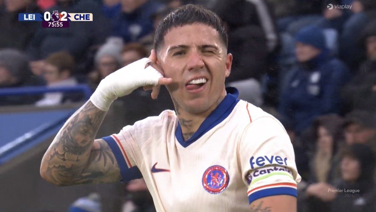 Enzo Fernandez celebrates his goal with a phone gesture.