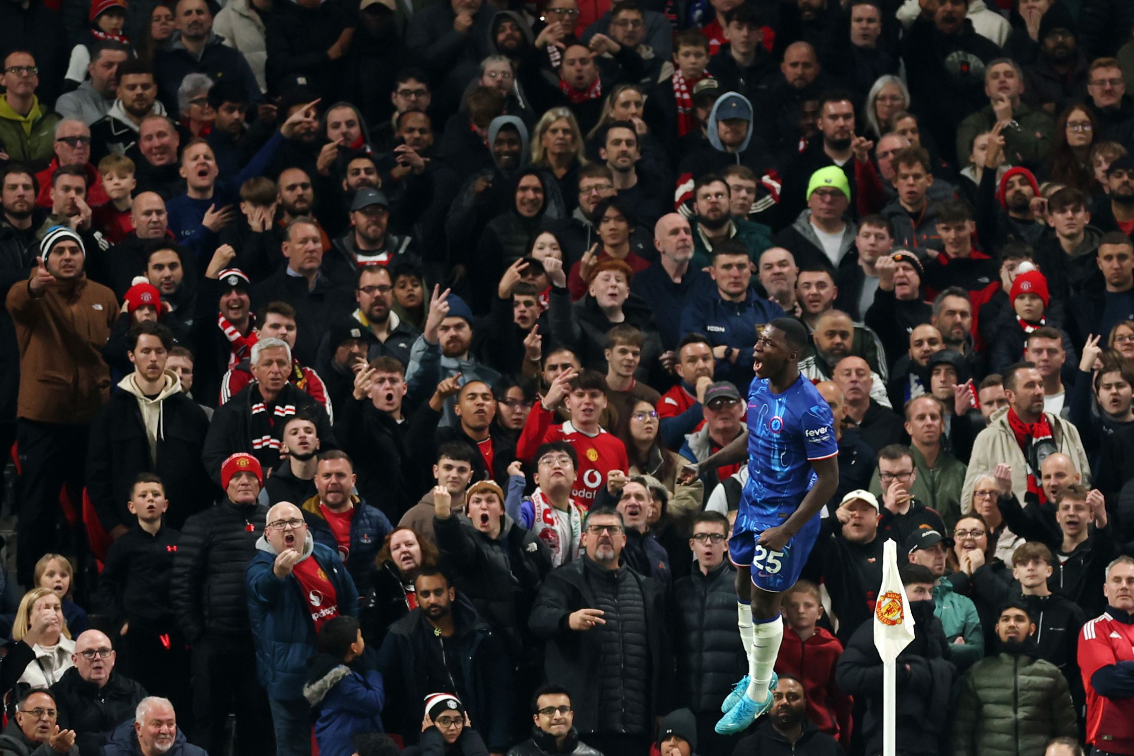 Moises Caicedo celebrates in front of angry Man U fans. (Photo by Carl Recine/Getty Images)