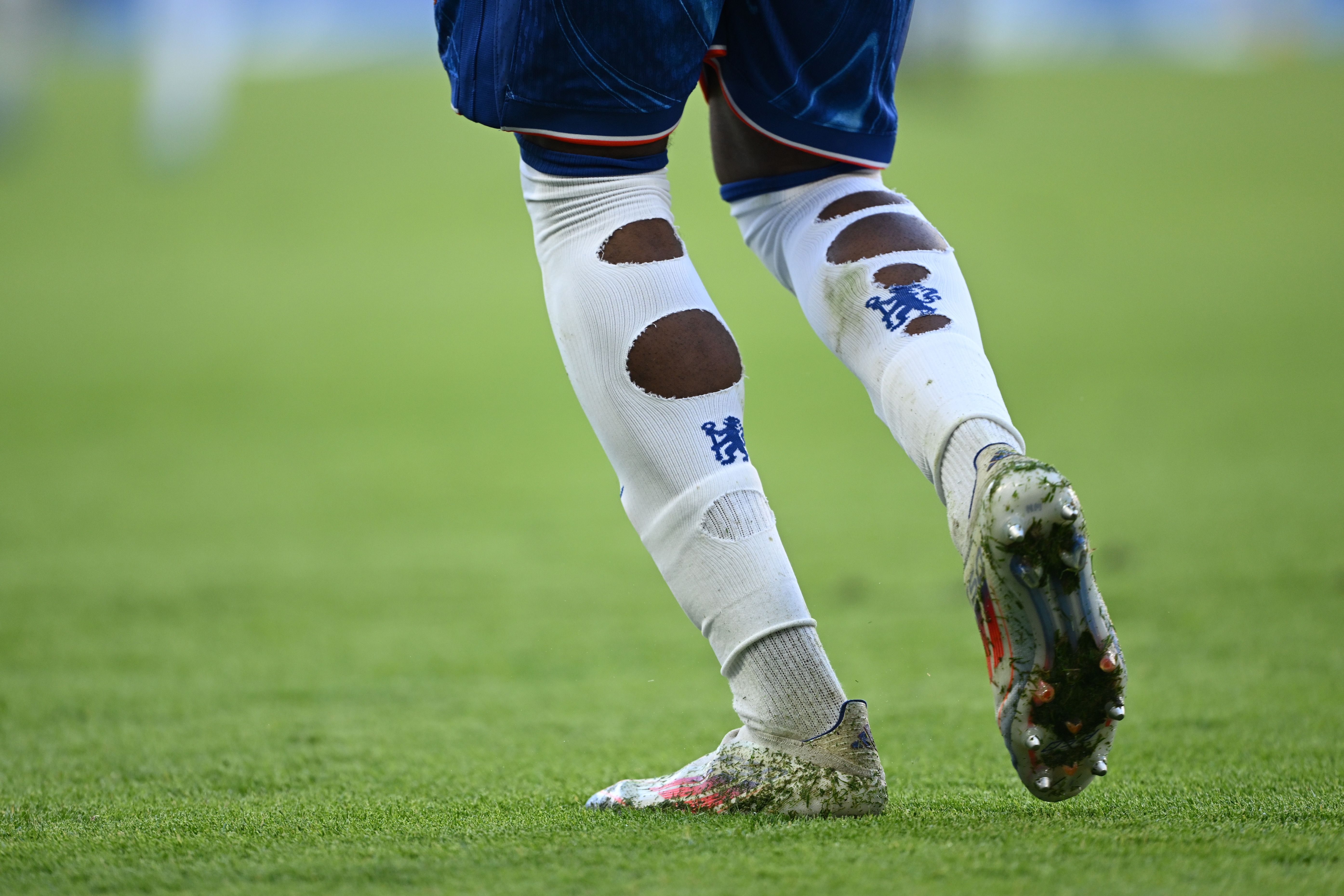 Noni Madueke's torn up socks. (Photo by Mike Hewitt/Getty Images)