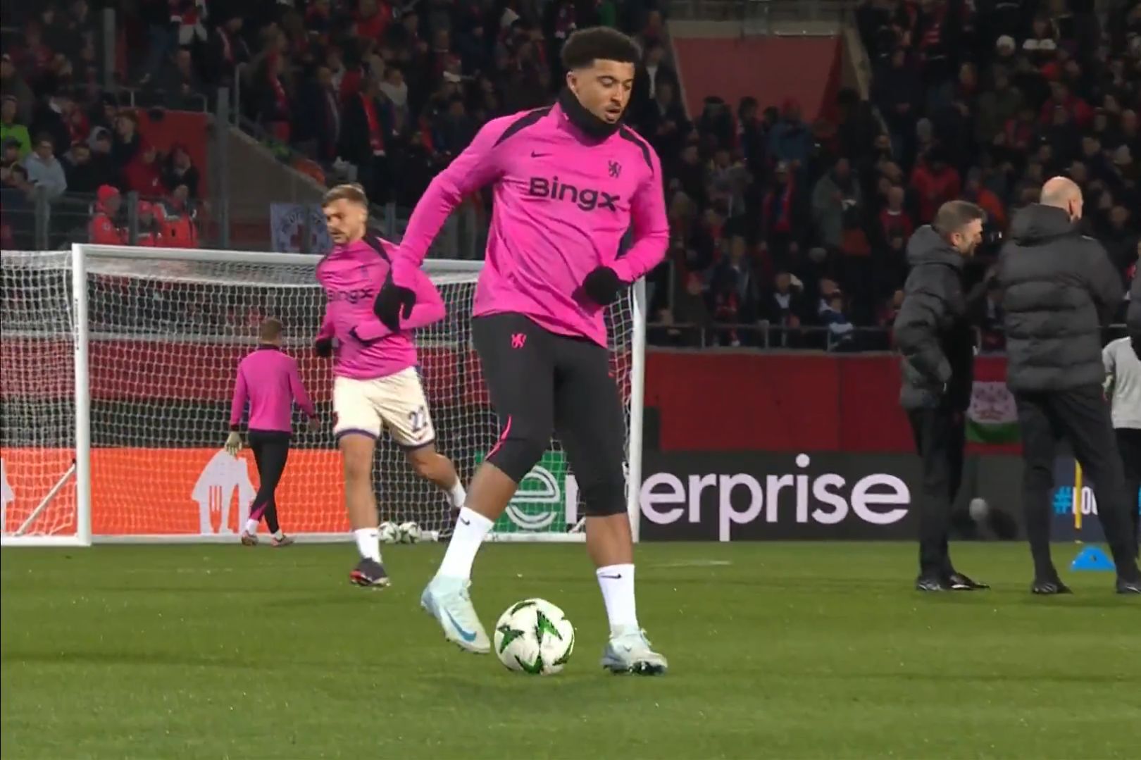 Jadon Sancho warms up before a Conference League game.