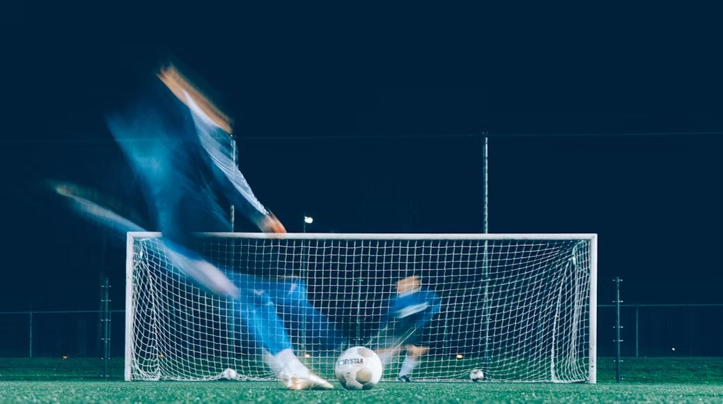 Timelapse of soccer player kicking ball. (Photo by Jannes Glas/Unsplash)