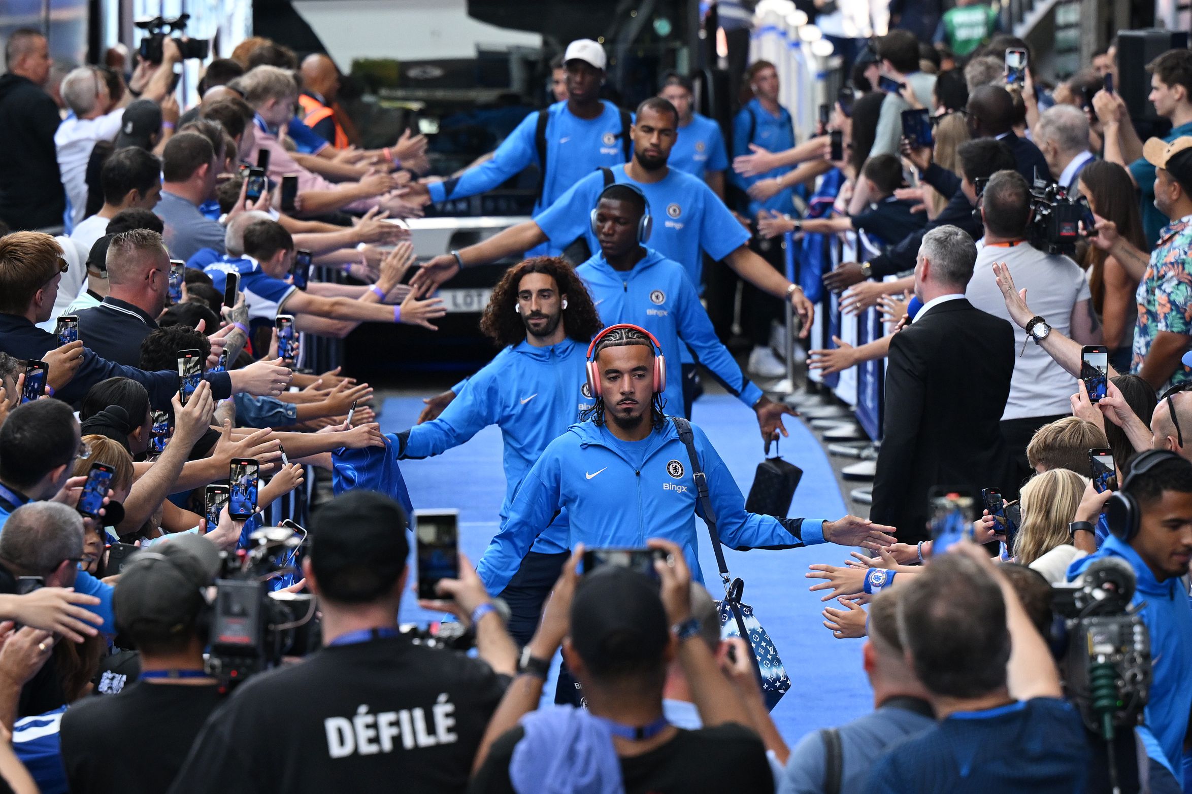 Marc Cucurella and Malo Gusto lead a line of Chelsea players. (Photo by Shaun Botterill/Getty Images)