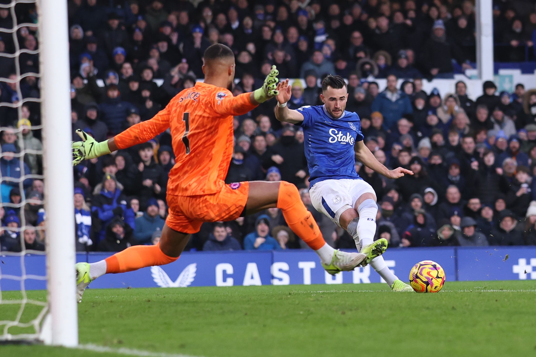 Robert Sanchez spreads himself to stop Jack Harrison's shot. (Photo by Carl Recine/Getty Images)