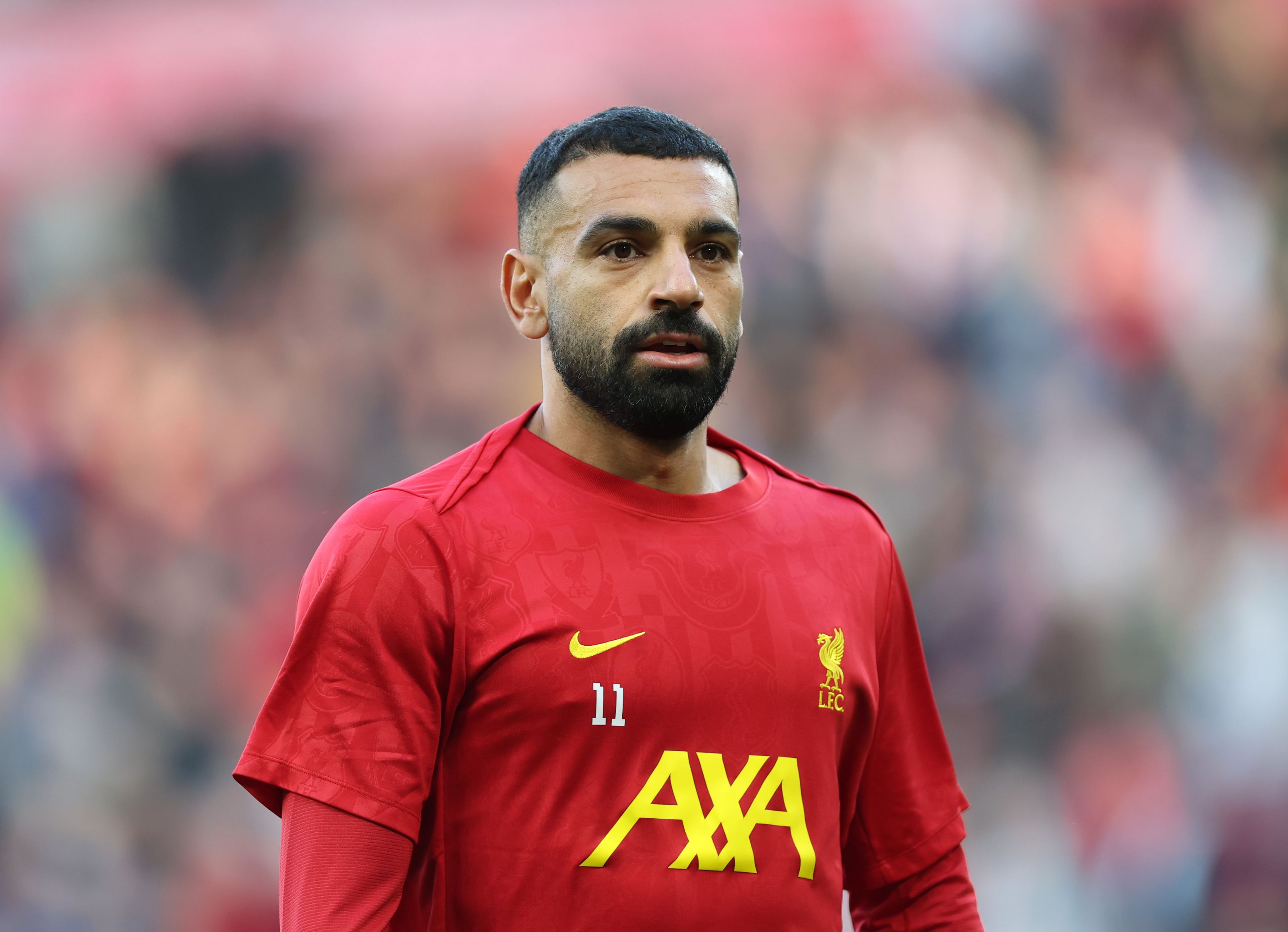 Mohamed Salah warms up for Liverpool. (Photo by Carl Recine/Getty Images)