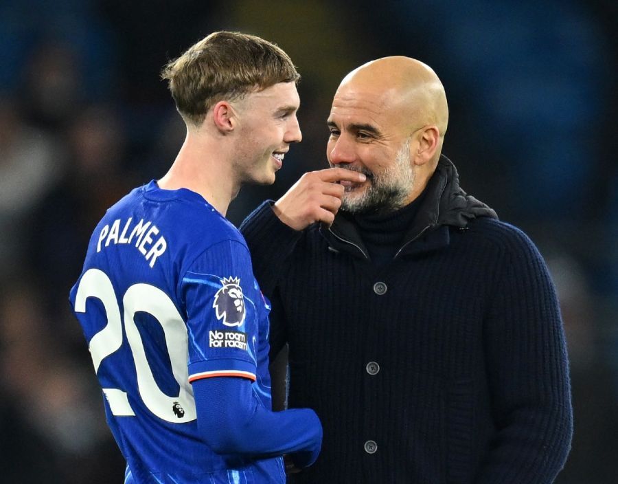 Cole Palmer smiles and talks to Pep Guardiola.