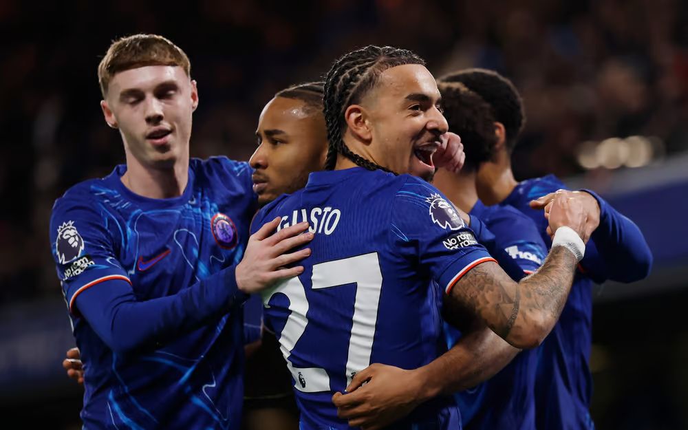 Chelsea celebrate in a group.