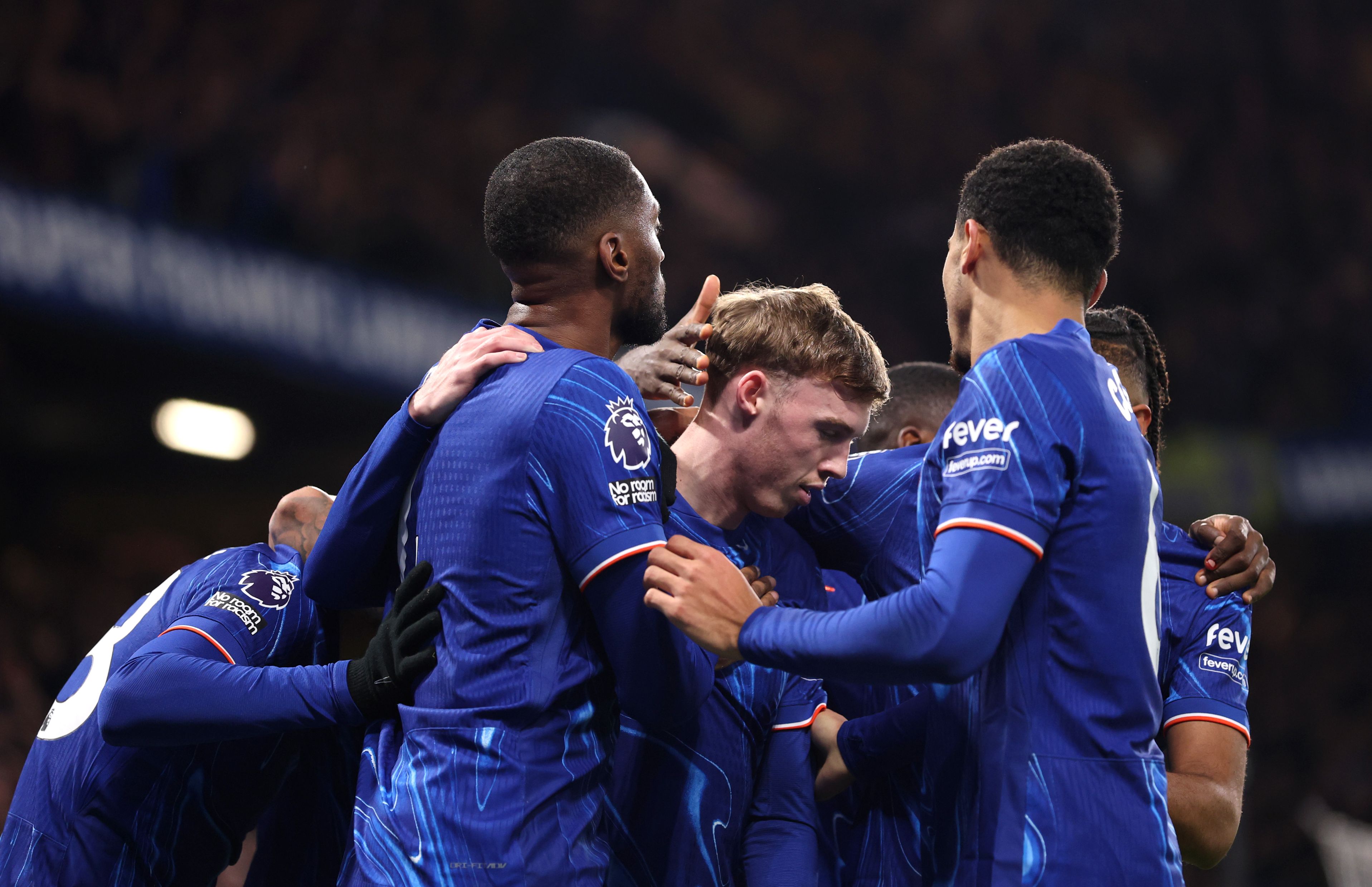 Chelsea players celebrate scoring against West Ham.