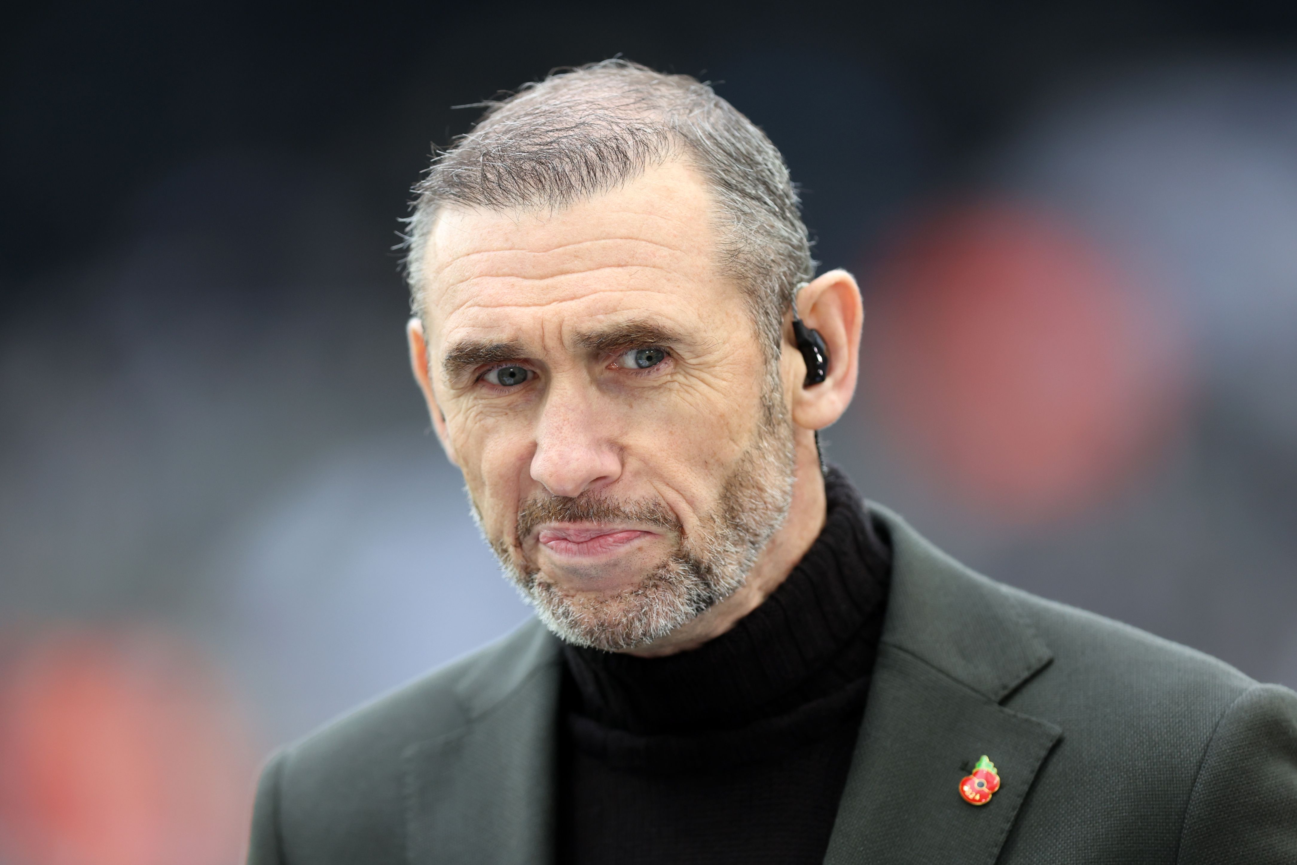 Martin Keown doing punditry for TNT Sports.