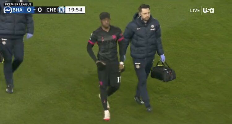 Noni Madueke limps off injured.