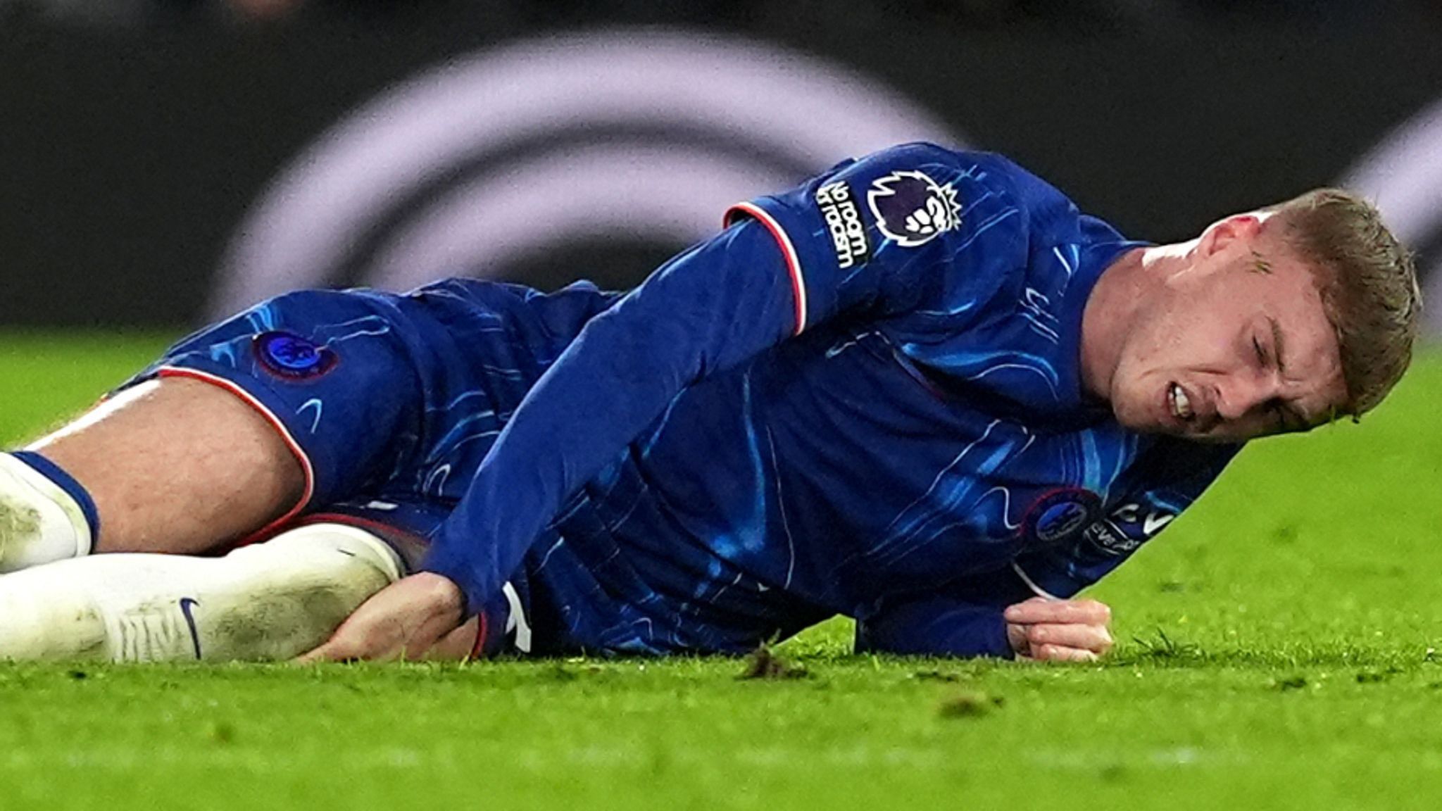 Injured Cole Palmer on the ground.