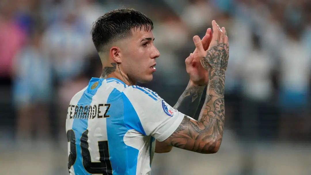 Enzo Fernandez applauds the fans while playing for Argentina.