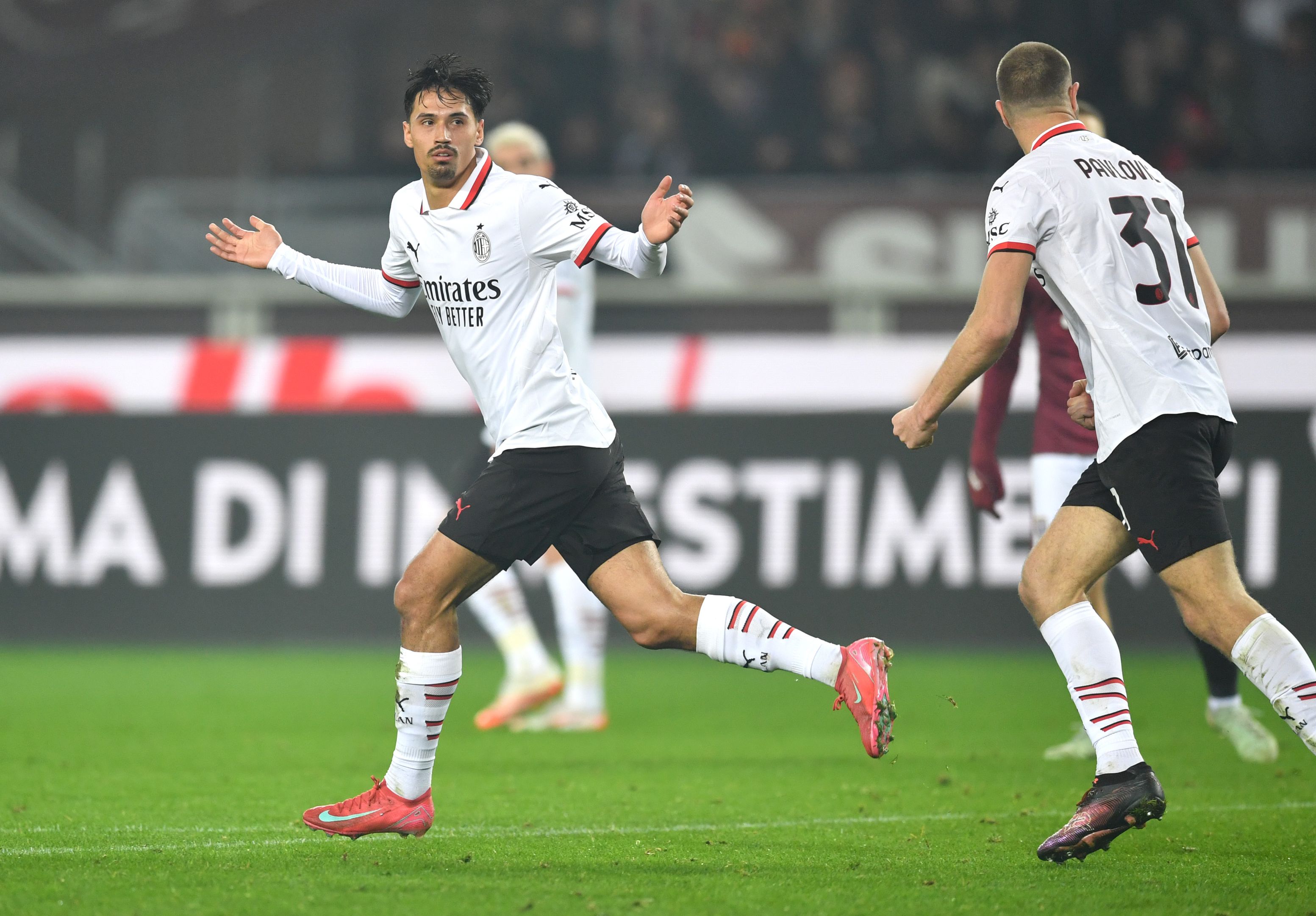 Tijjani Reijnders celebrates scoring for AC Milan.