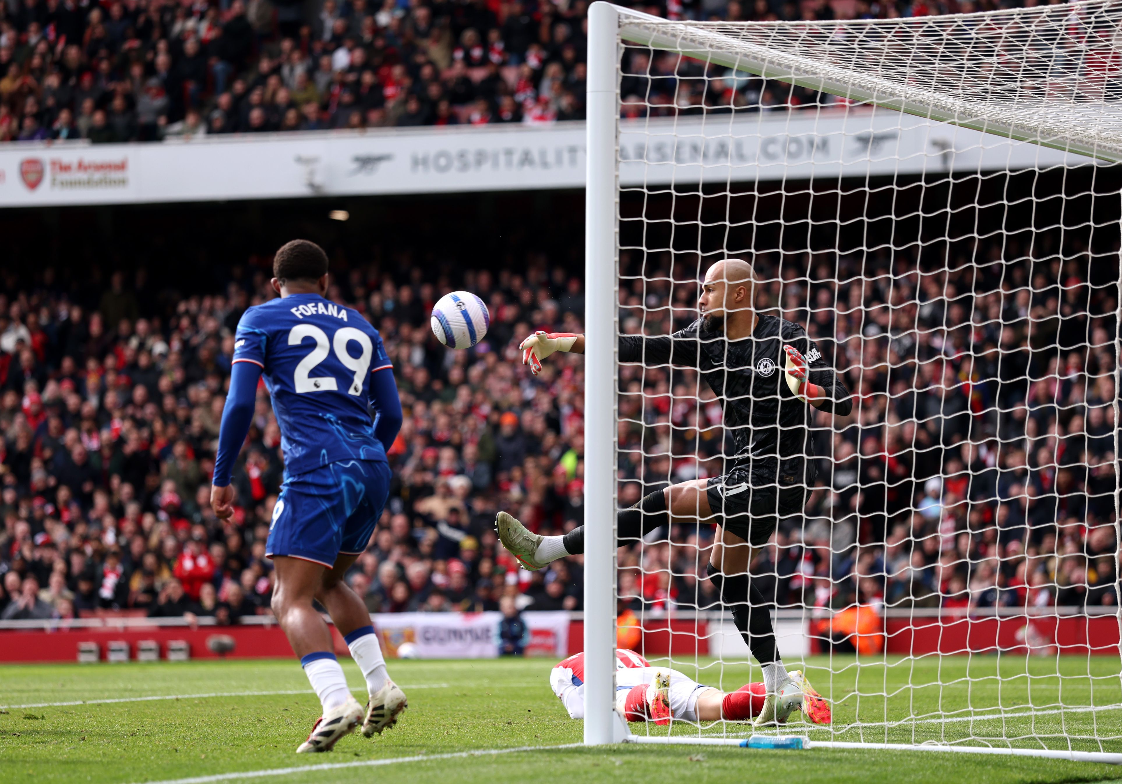 Robert Sanchez makes a save against Arsenal.