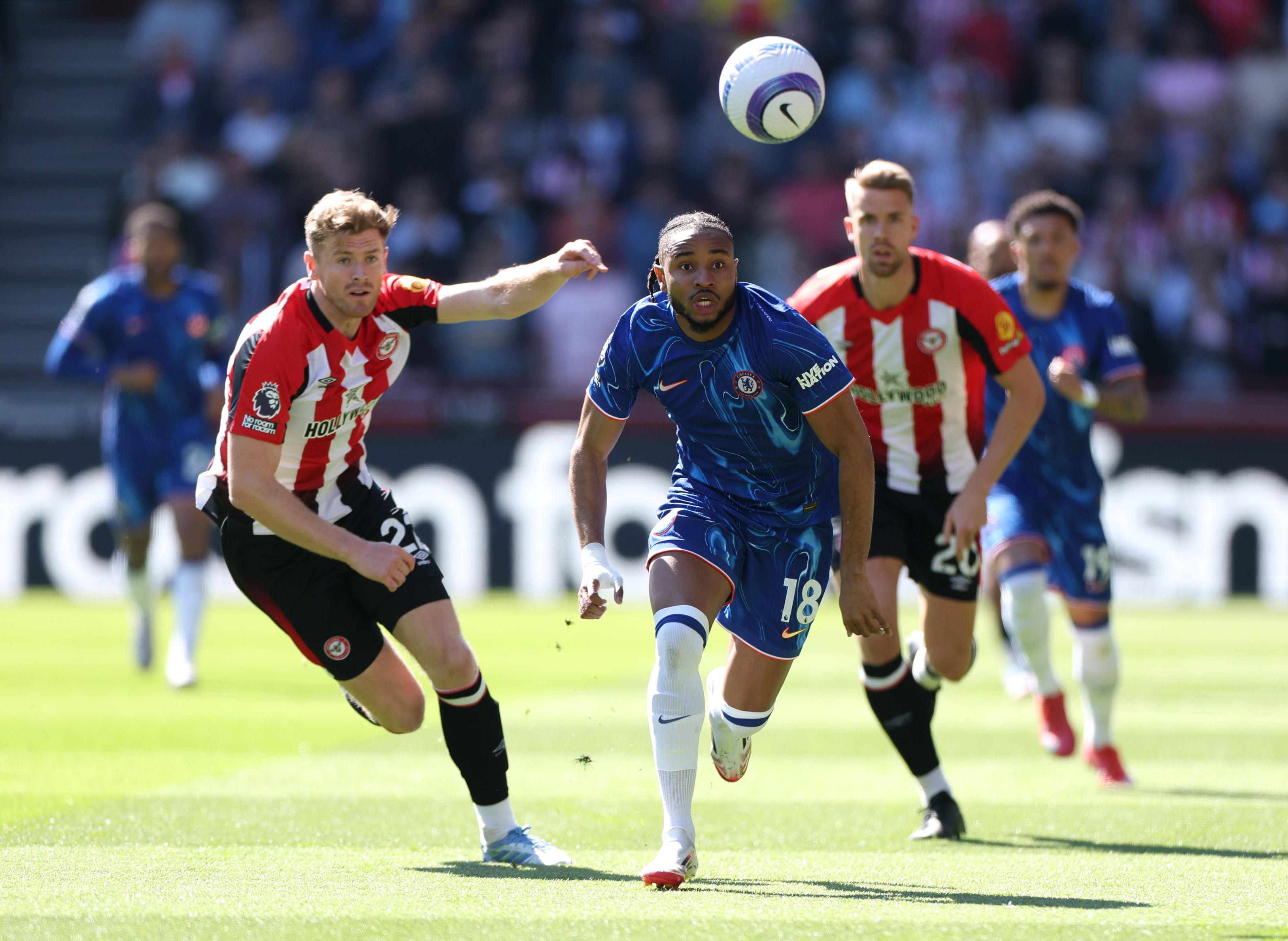 Christopher Nkunku chases a ball against Brentford.