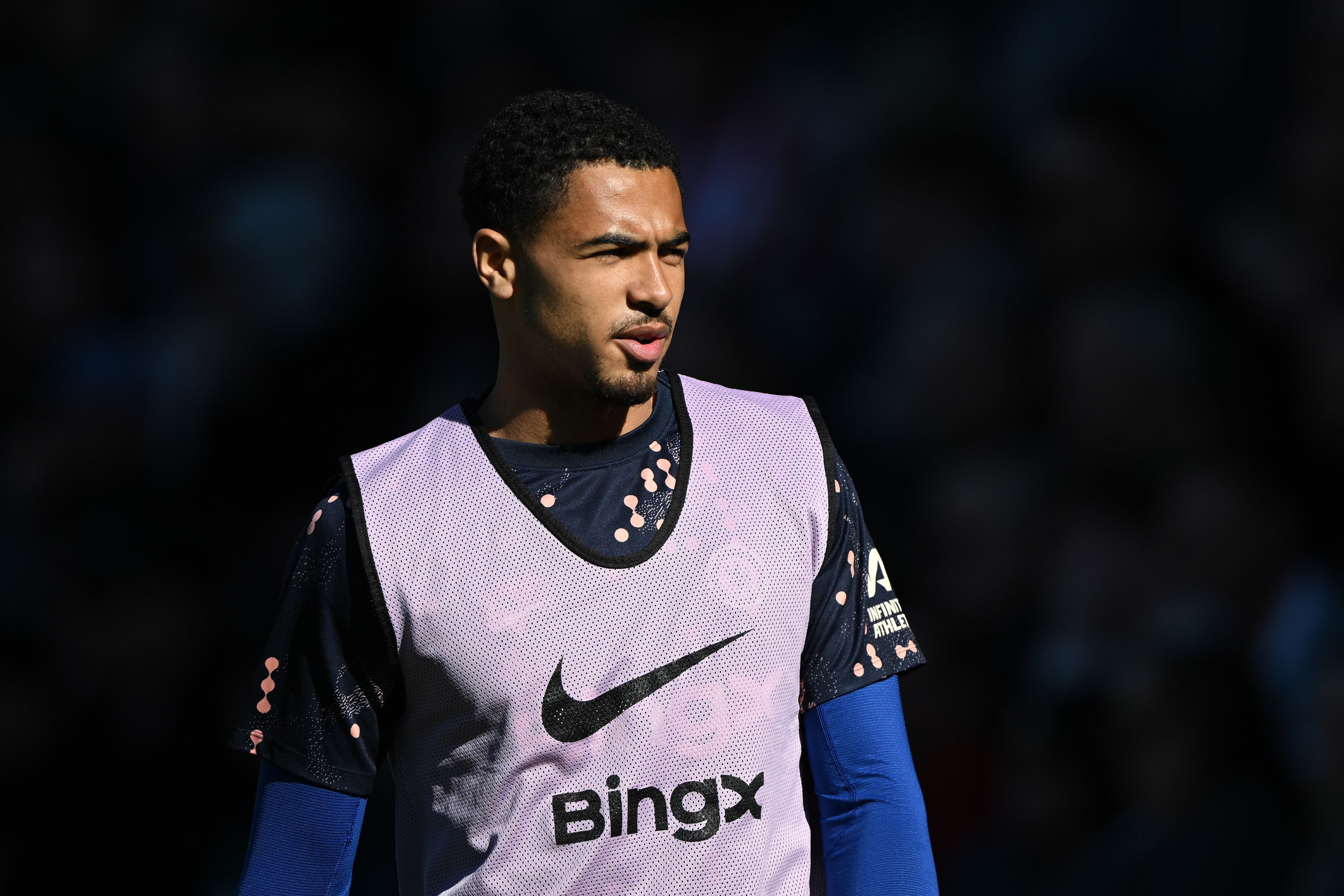 Levi Colwill warms up for Chelsea.