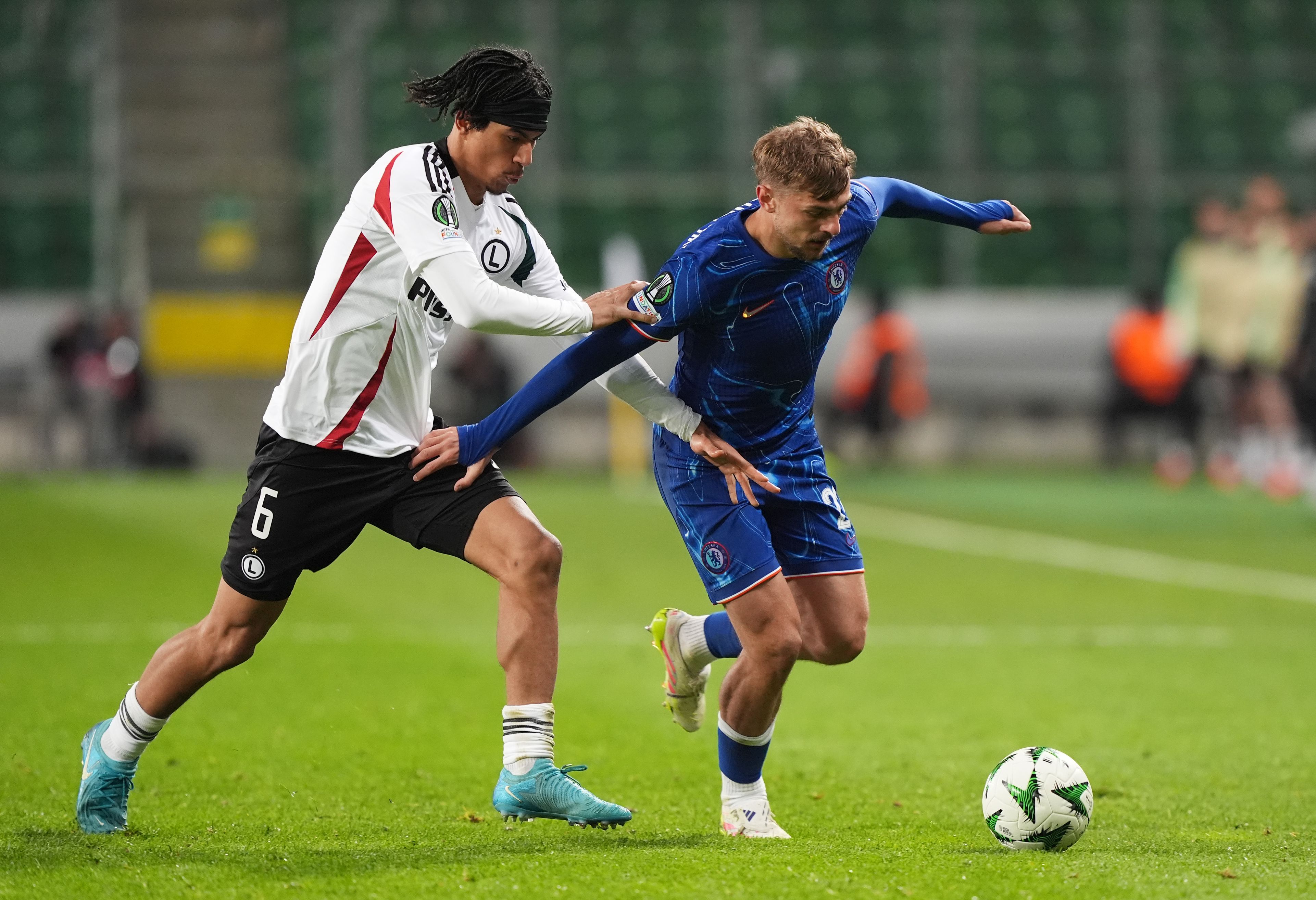 Kiernan Dewsbury-Hall battles for possession against Legia Warsaw.