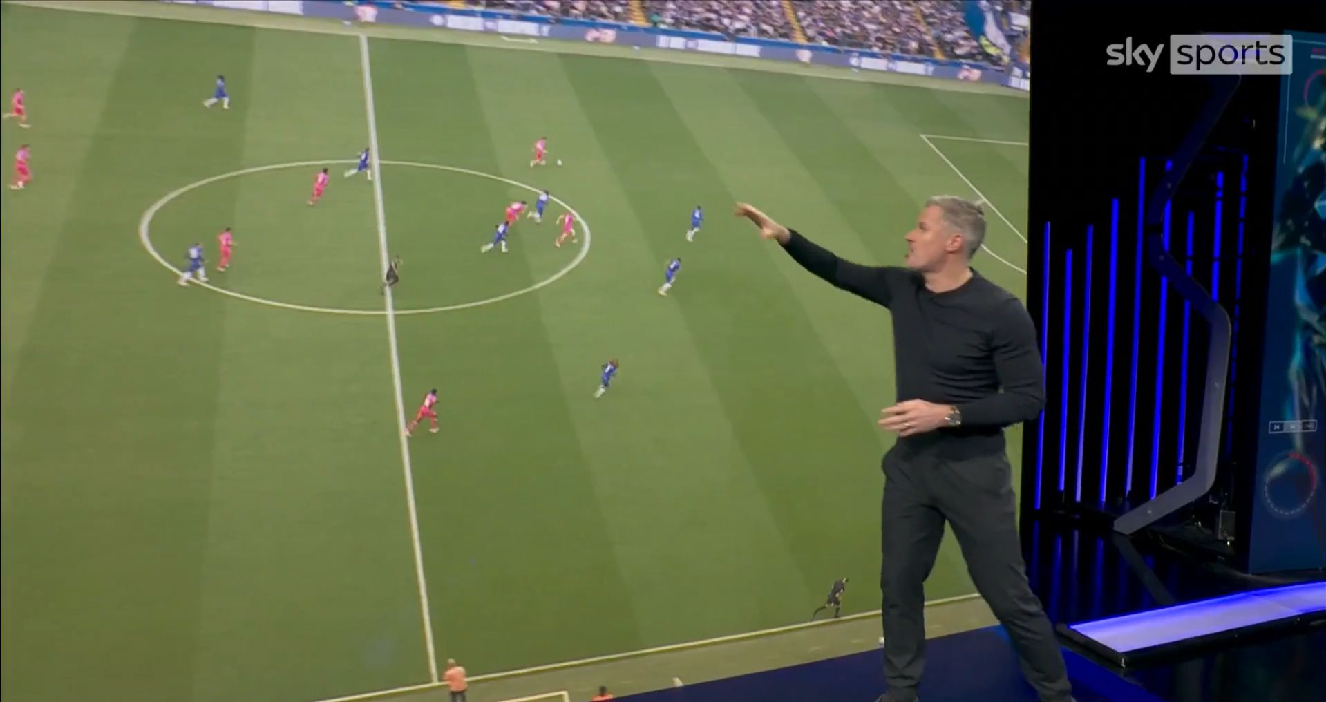 Jamie Carragher points at a Chelsea turnover on Monday Night Football.