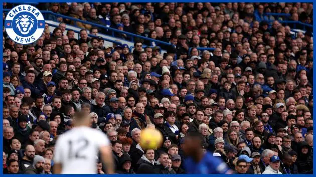 Chelsea fans watch a game.