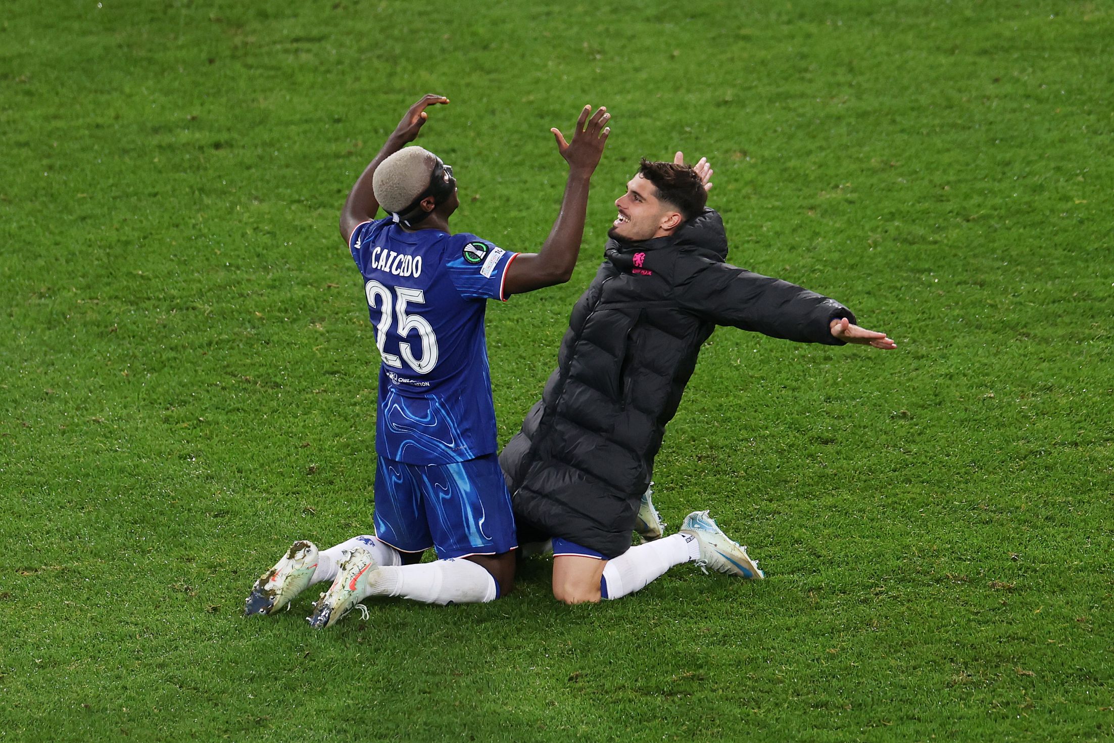 Moises Caicedo celebrates with Pedro Neto.