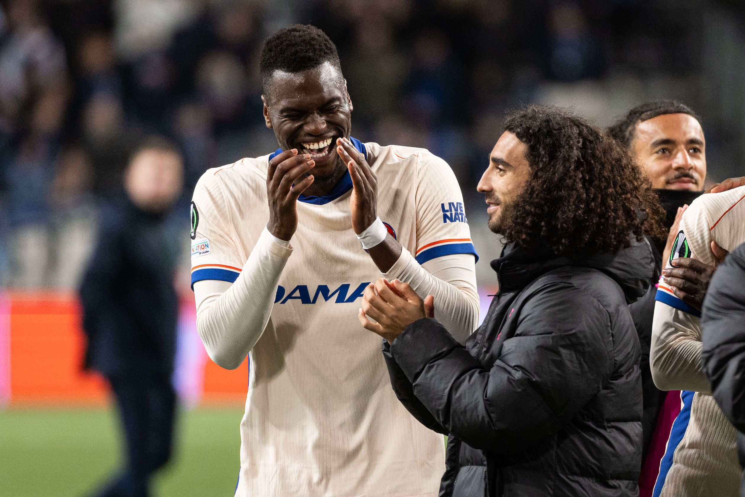 Benoit Badiashile laughs with Marc Cucurella at full time.