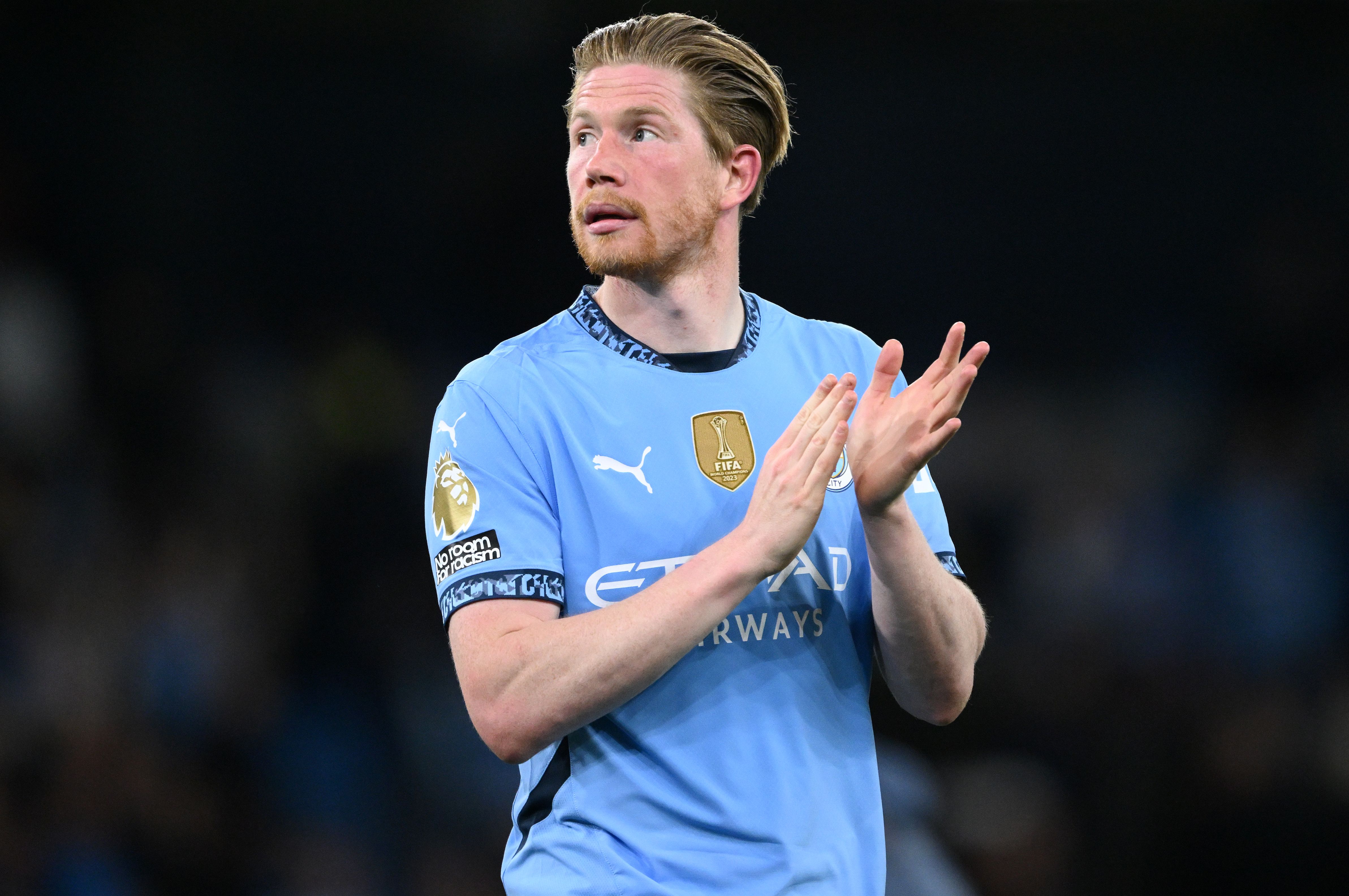 Kevin De Bruyne applauds Manchester City fans.