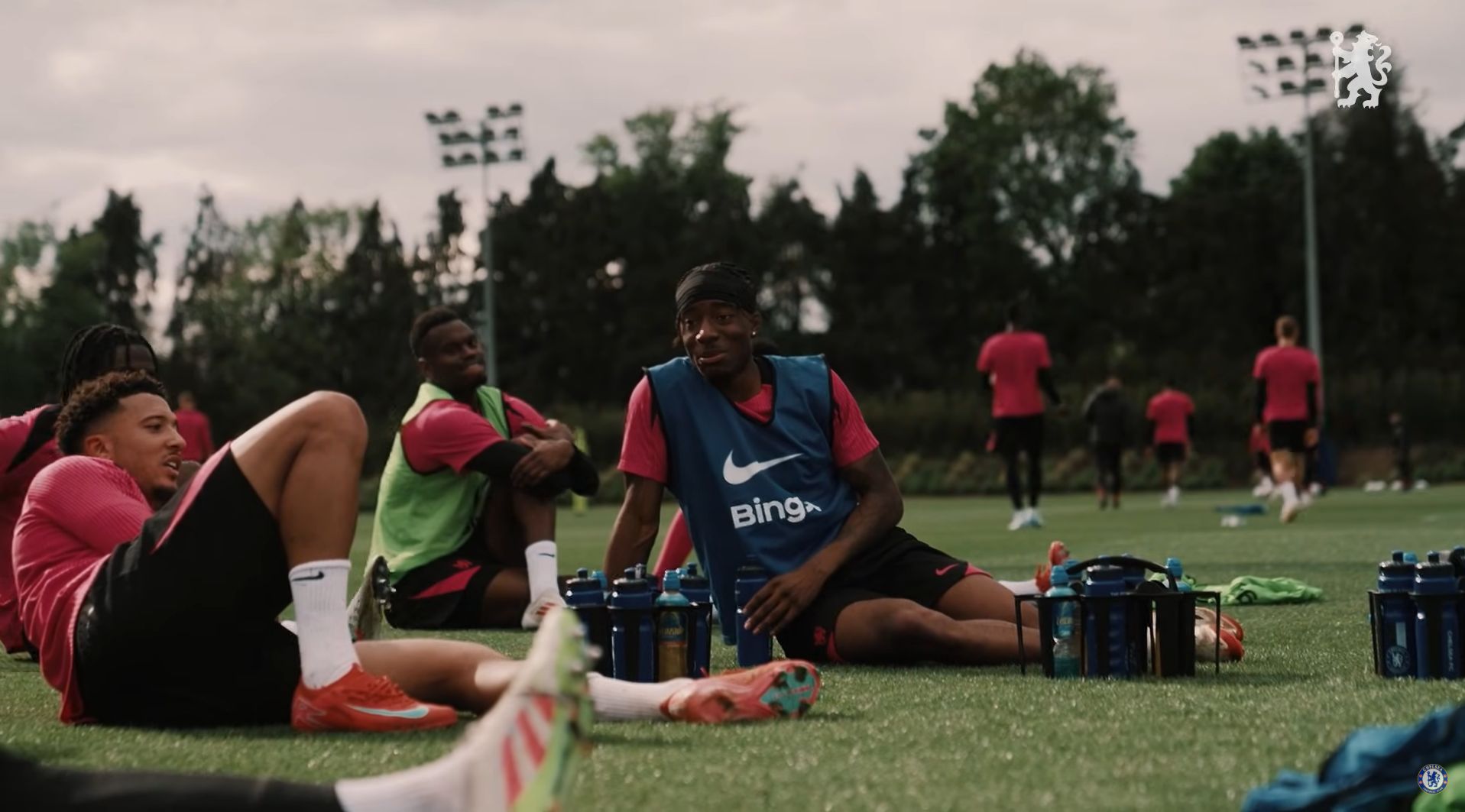Noni Madueke chats in training.