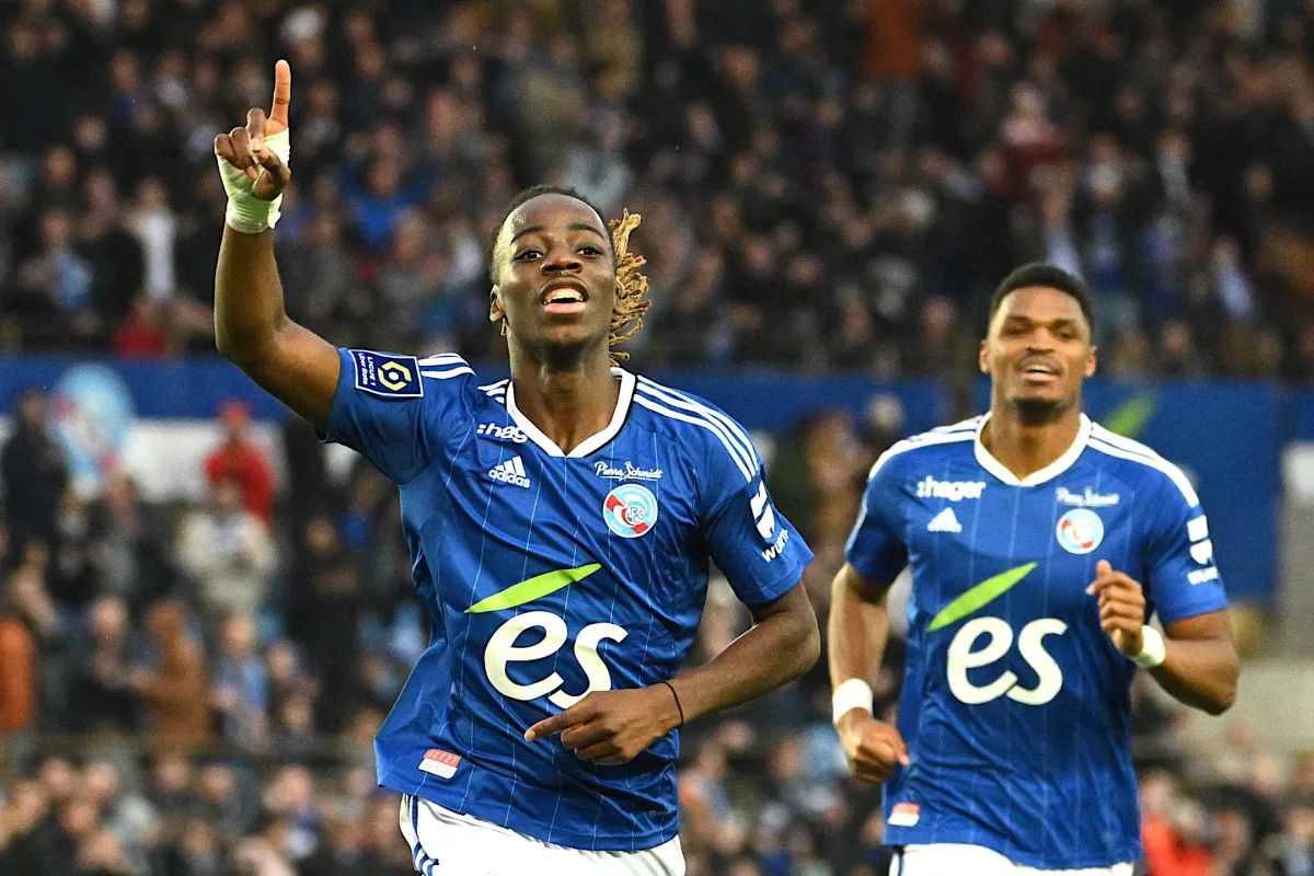 Ismael Doukoure celebrates scoring for Strasbourg.