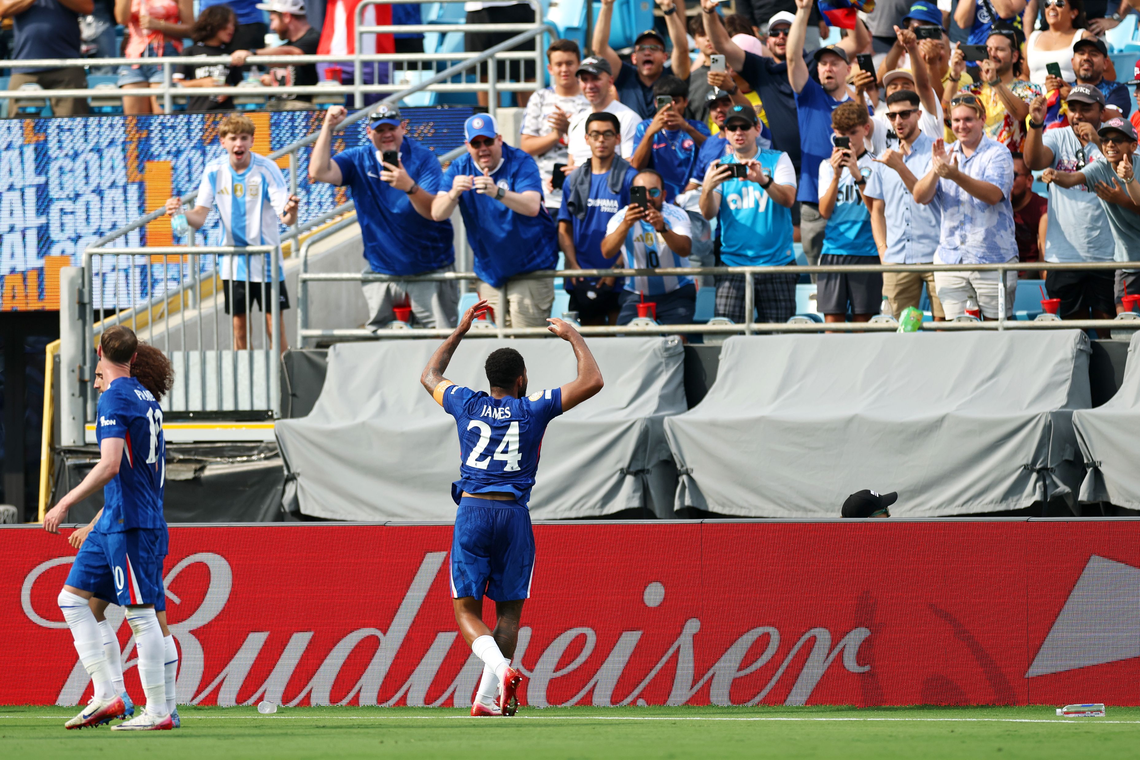Reece James celebrates scoring against Benfica.