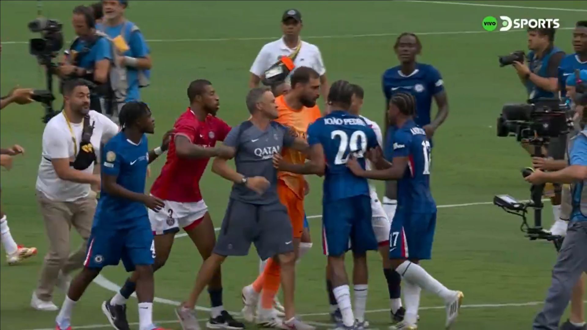 Luis Enrique lunges for Joao Pedro.Luis Enrique lunges for Joao Pedro.