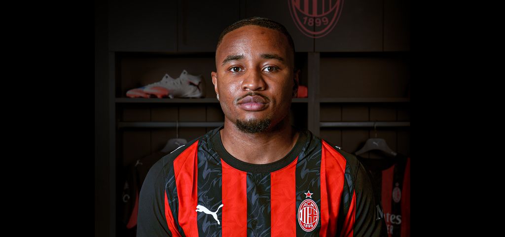 Christopher Nkunku wearing an AC Milan shirt for the first time.