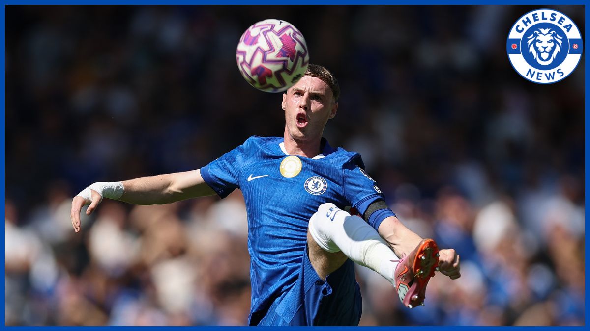Cole Palmer controls the ball in midfield.