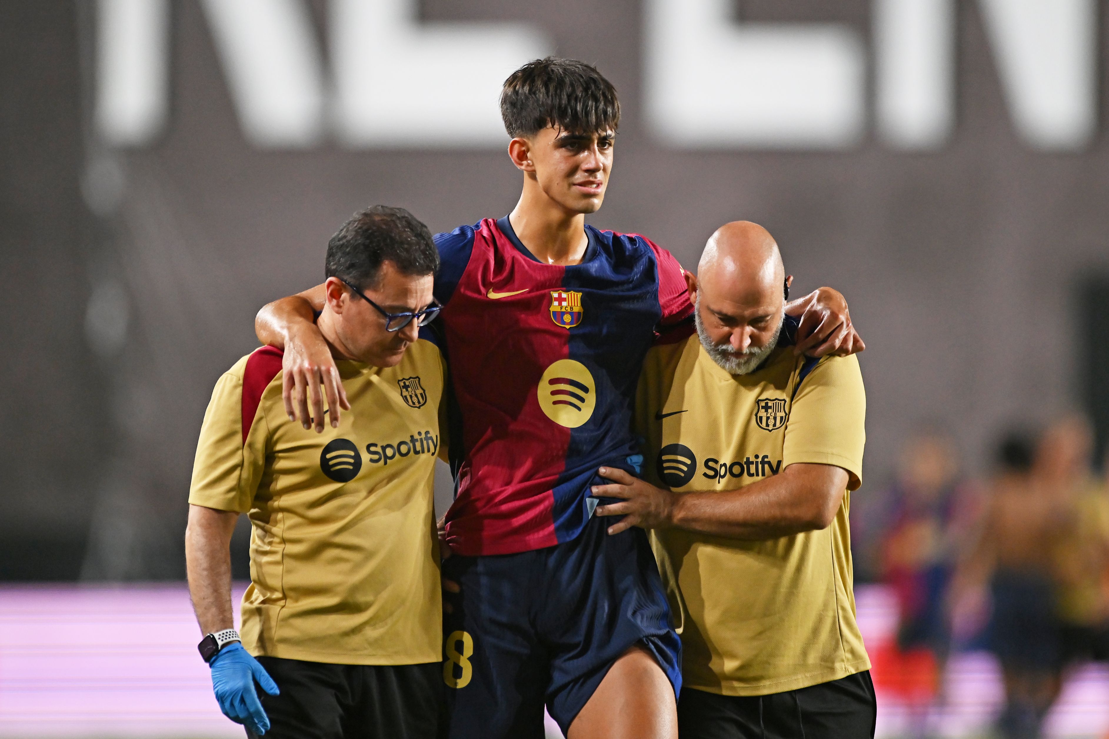 Marc Bernal leaves the pitch injured.