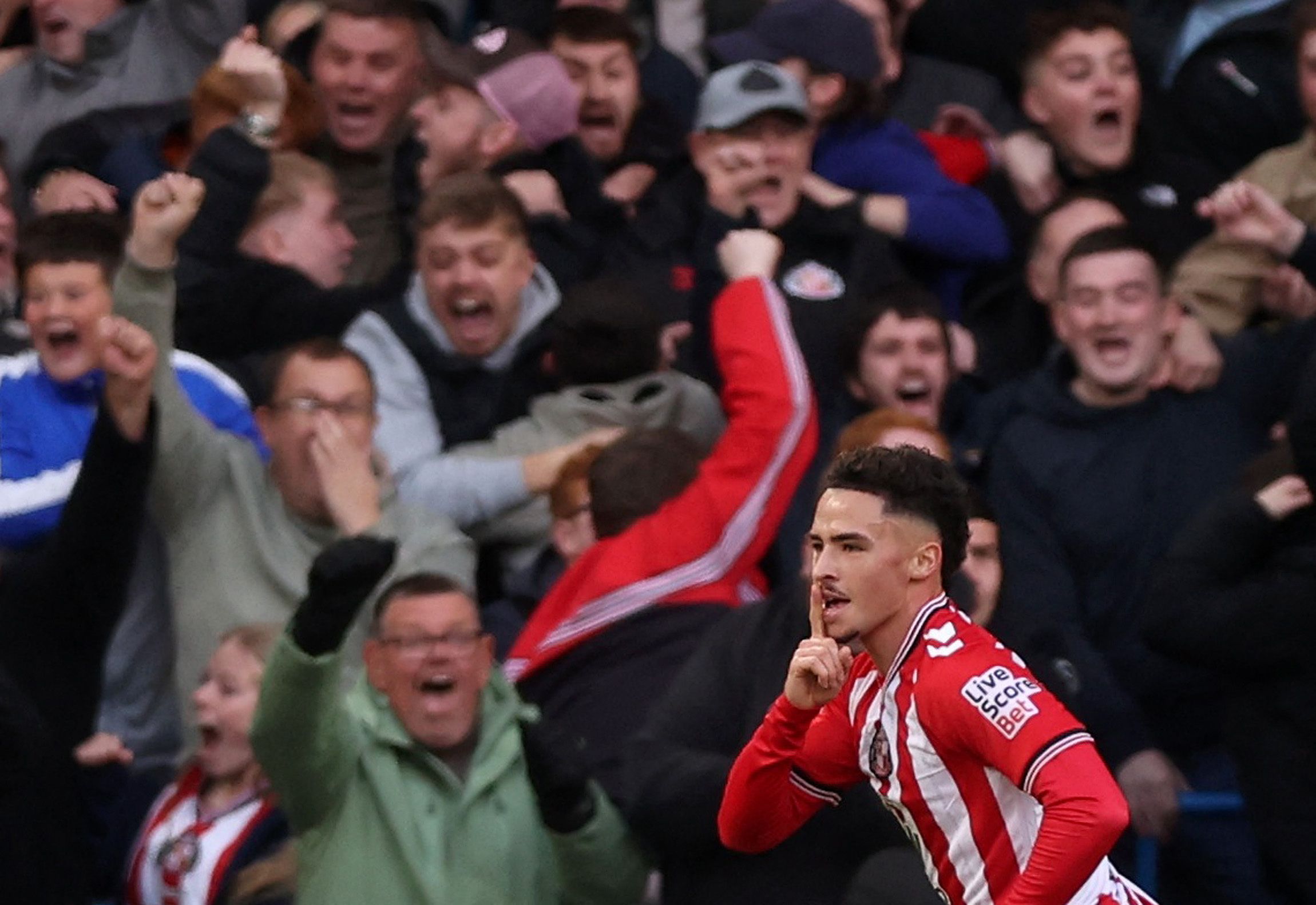 Chemsdine Talbi celebrates at Stamford Bridge.
