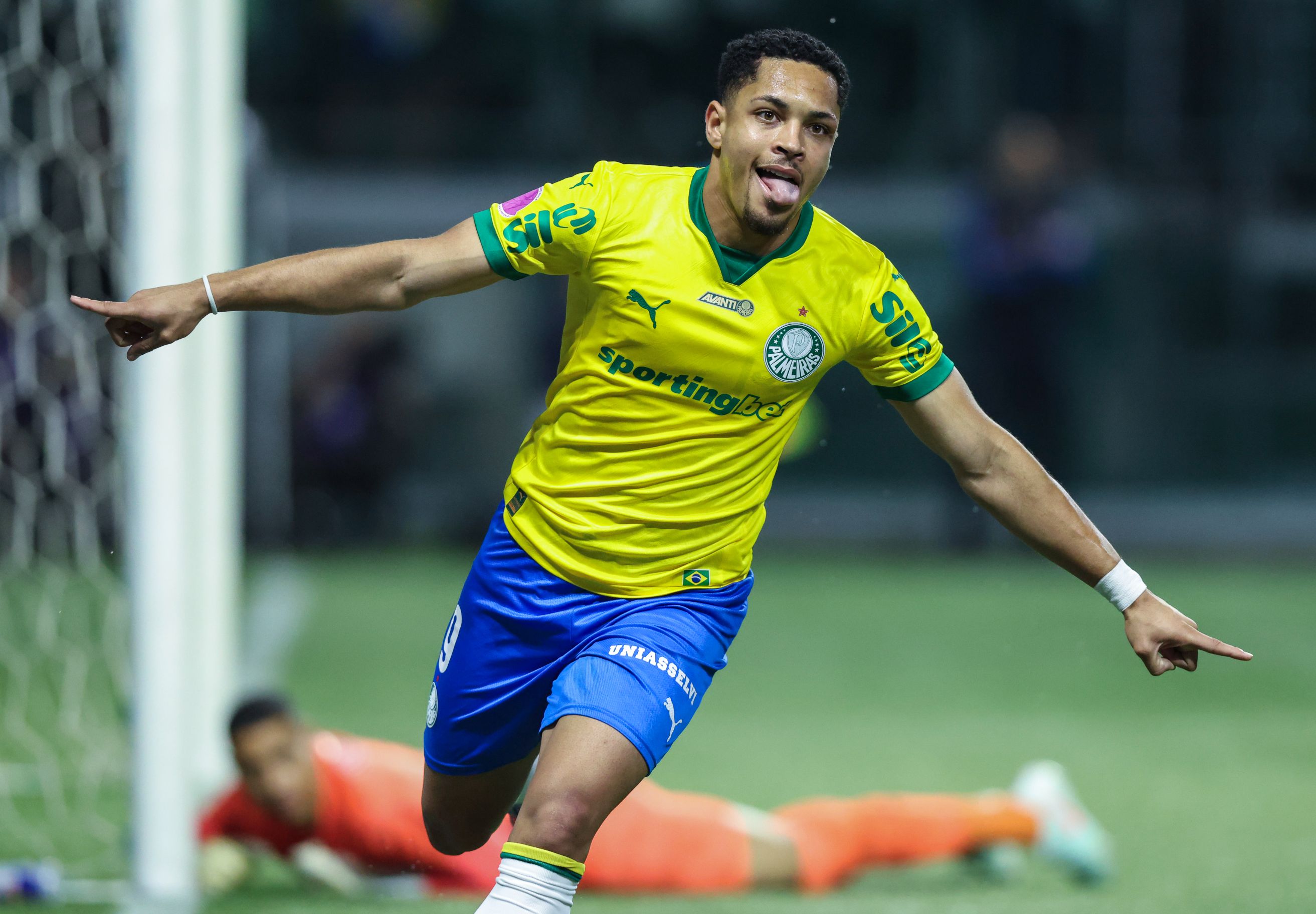 Vitor Roque celebrates scoring for Palmerias.