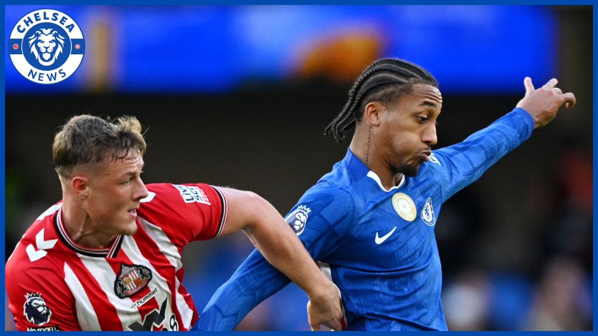 Joao Pedro battles for the ball.