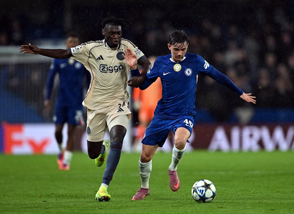 Reggie Walsh battles in midfield against Ajax.