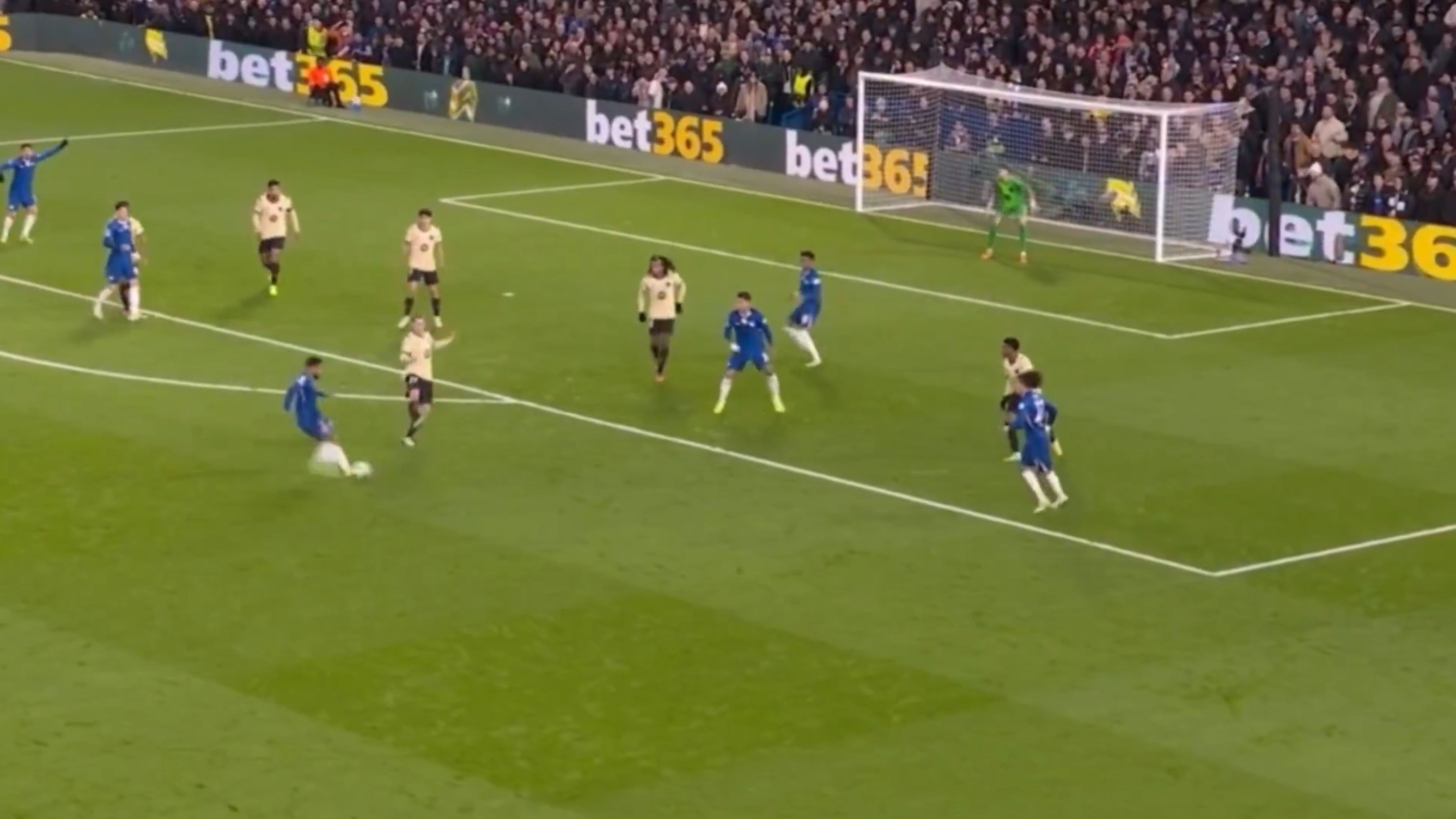 Reece James chips one into the box.